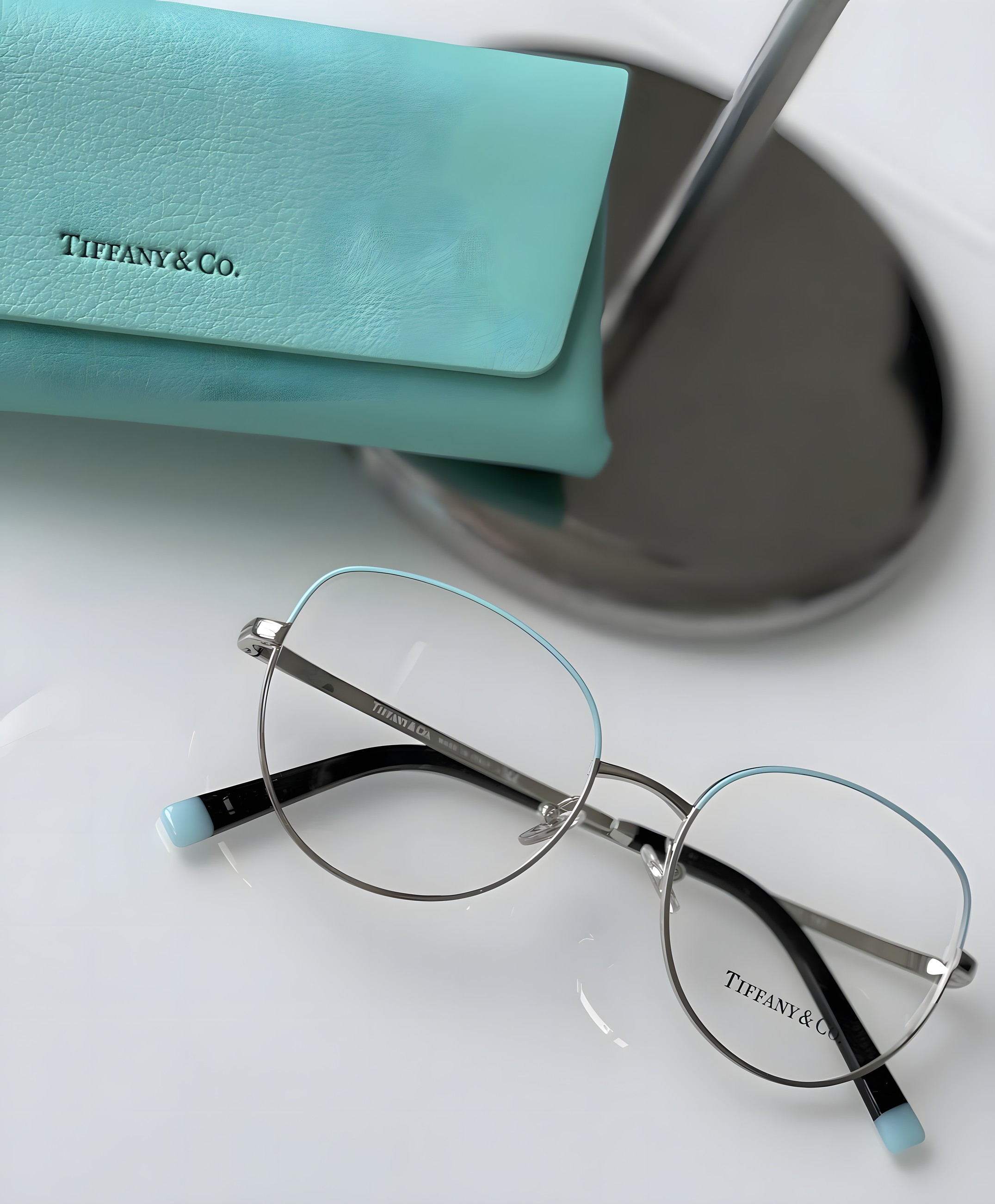 Tiffany & Co. round metal optical frame in silver with pale blue trim
