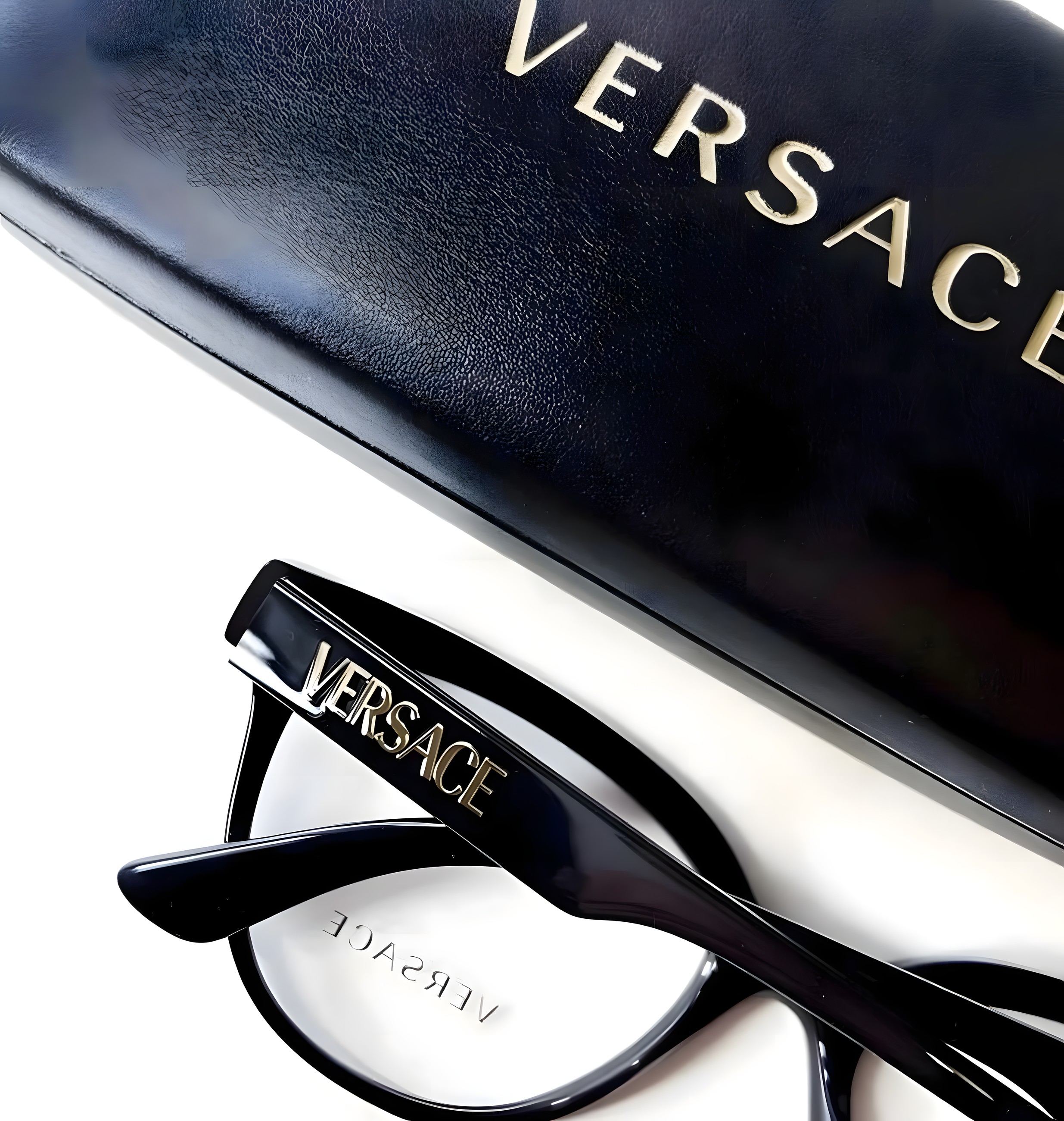Black Versace optical glasses beside a leather case