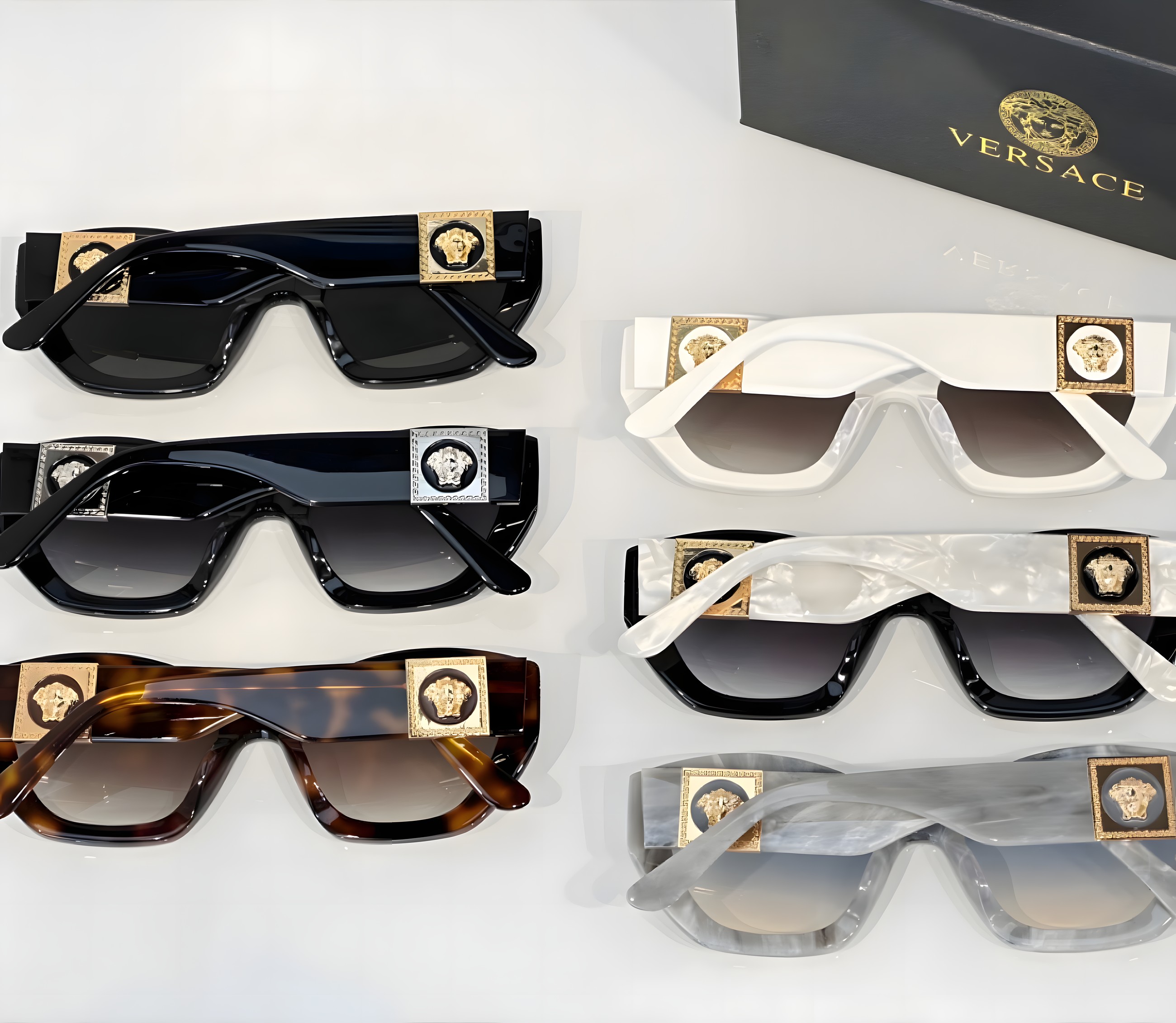 A display of Versace sunglasses in black, white and tortoiseshell